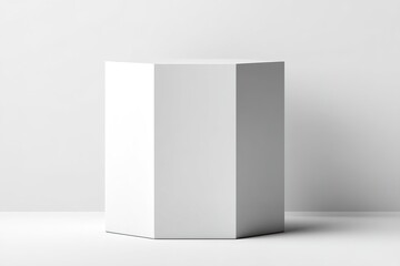 Poster - Modern geometric white pedestal displayed in a minimalist interior during daylight, creating an elegant focal point