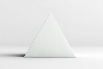 Poster - Minimalist geometric triangle sculpture placed on a smooth surface with soft lighting during a neutral decor setting