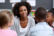© Mselected - Teacher engages with students in a classroom setting during a learning activity
