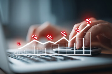 Poster - hands using calculator, laptop, with superimposed upward trending graph and percentage symbols, repr