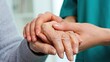 © Arnab Dey - A female nurse caregiver holds hands to encourage and comfort an elderly woman. For care and trust in nursing homes for people of retirement age Caregiver helping elderly woman provides medical advice