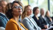 © MST - A diverse group of individuals is seated in an auditorium, attentively listening to a presentation