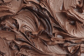 Poster - A close-up shot of rich, creamy chocolate frosting swirls, creating a delicious and inviting abstract texture for culinary backgrounds and dessert designs.