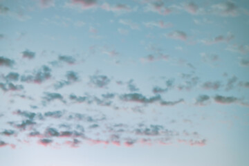 Wall Mural - A beautiful sky tinted by the sun leaving vibrant shades of gold, pink, blue and multicolored. Clouds in the twilight evening and morning sky. Cloudy sky background in the evening, and during the day.