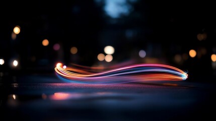 Aufkleber - Abstract light trails across a wet surface with vibrant colors and bokeh background suggesting motion and urban environment at night