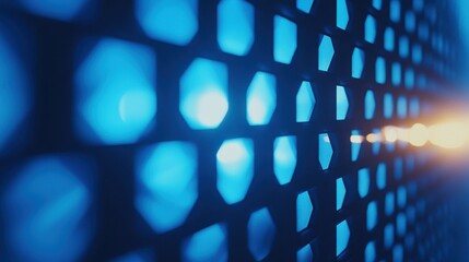 Poster - Blue light shines through a dark, geometric, honeycomb-like metal grid. Use for technology, security, or abstract design backgrounds.