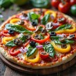 © Atizaz  - Colorful vegetarian pizza loaded with bell peppers, olives, red onions, mushrooms, and spinach