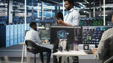 Poster - data center technician using tablet to do node tree programming, optimizing resource allocation. ser