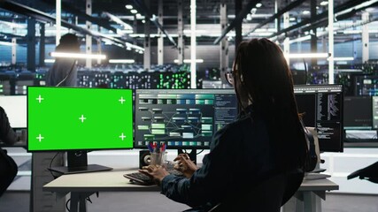 Poster - data center technician using node tree software on green screen pc to analyze datasets. server room 