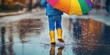 © Musa - A Small Child Jumps in a Puddle with a Colorful Umbrella