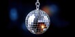 © Sebelas Studio - Mirror ball hanging, disco party, dance floor with colorful lights, decoration