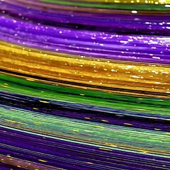 Poster - Abstract of Intertwined Stripes in Festive Mardi Gras Colors with Shimmering Texture and Light Effects.