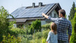 © Martin - Family admiring solar panels on new home roof