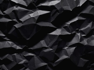 Poster - Crumpled black paper creates a textured, abstract background suitable for various artistic applications