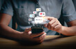 © Sutthiphong - Social media interaction and online engagement concept with smartphone notifications. User touching screen to respond to likes, messages, and comments. Digital communication and network connection.