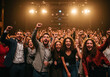 © Midea  - A group of people cheering at a concert.