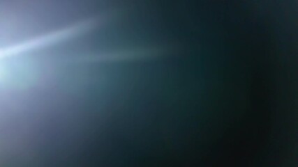 Wall Mural - beautiful abstract defocused highlight on a dark background. real light leaks and glare.