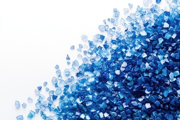 Poster - A gradient of blue crystals scattered on a white background, creating a visually appealing and calming image.