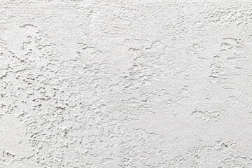 Wall Mural - A white wall with a rough texture