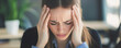© AGCreative - Stressed woman holding her head in frustration, showing signs of anxiety and overwhelm in modern office environment. scene captures emotional toll of work related pressure