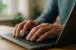 © Shehroo Time - Focused Typing on Laptop Keyboard in Natural Light