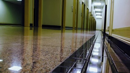 Poster - Long Corridor with Glossy Floor and Reflection in Modern Building