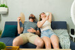 © AntonioDiaz - Overheated couple sweating at home during summer heat wave