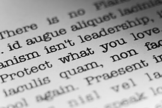 Protect what you love. Text printed on a page. A piece of paper with a phrase written in retro typewriter font.