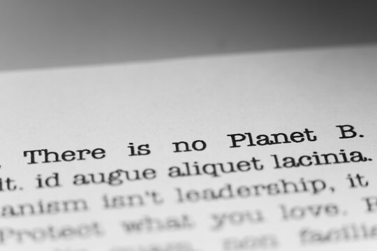 There is no Planet B. Text printed on a page. A piece of paper witha phrase written in retro typewriter font.