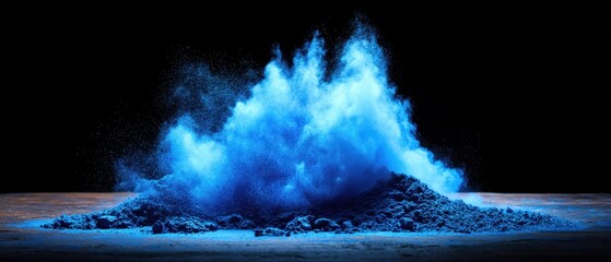 Poster - Captivating blue powder explosion against dark background creating dynamic abstract art in studio shot with dramatic lighting and vibrant color
