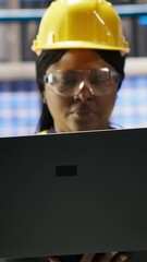 Poster - vertical video smart factory engineer using laptop to implement automated workflows and control syst