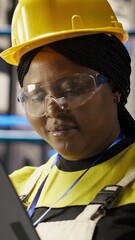 Poster - vertical video solar panels plant expert uses tablet to oversee systems, ensuring machinery operates