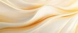 © suvijak - Soft Waves of Creamy Fabric Flowing Elegantly in a Subtle Abstract Texture Background