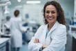 © Molly P - A smiling female scientist in a laboratory setting presents confidence and professionalism. She wears a white coat, embodying dedication to research and healthcare.