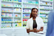 © bnenin - Professional Pharmacist Assisting Customer at Modern Pharmacy Counter