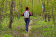 © Xalanx - Woman hiking through spring forest