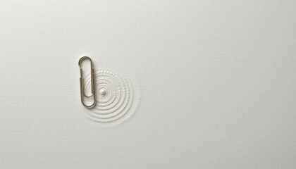Poster - Creative paperclip ripple effect minimalist white surface abstract photography calm environment top-down view visual concept