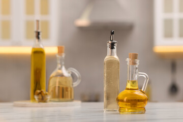 Wall Mural - bottles of salad dressings on white table in kitchen, space for text