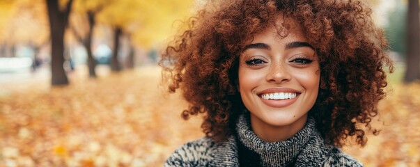 Aufkleber - Young woman smiling with afro hair in autumn park