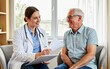 © Yuudaishin - Caring medical care moment in a comfortable clinic examination room with a young female doctor talking gently with an elderly male patient and carefully listening to his symptoms and health condition