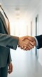 © Passion - Close-up handshake between business professionals in modern office setting