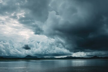 Wall Mural - dramatic overcast sky with gray clouds forming moody and tranquil backdrop before rain, capturing th