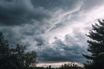 Wall Mural - dramatic overcast sky with gray clouds forming moody and tranquil backdrop before rain, capturing th