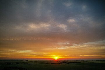Wall Mural - beautiful sunset with a bright orange sun in the sky