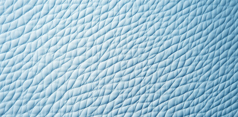 a close up of light blue leather showing an intricate textured pattern across the entire surface are