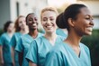 © Baba Images - diverse group of smiling female nurses at training at college