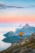 © EVERST - Travel in Norway - man hiking solo in mountains active adventure summer vacations, tourist exploring wild Scandinavian nature healthy lifestyle freedom concept islands and sea landscape moon and dawn