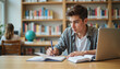 © Nii_Anna - Young student studying and writing notes in a library