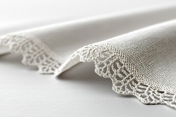 Poster - Delicate lace edge on a textured fabric showcasing intricate craftsmanship and elegance