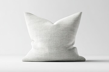 Poster - Soft white decorative pillow resting against a neutral backdrop in a minimalist setting suitable for cozy living spaces